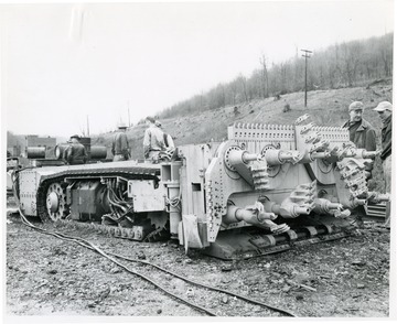 Continuous mining machine on arrival at Brock No. 4 Mine before taken inside mine.