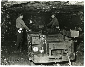 Miners using a cutting machine at Mine 32, Consolidation Coal Co.