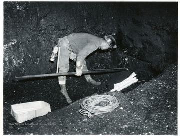Miner setting charges at Jamison No. 9.