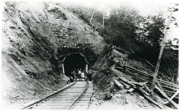 Miners stand outside of the west portal at Little Bull