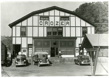 Crozer Coal and Coke Co. building with a few cars and people out front.