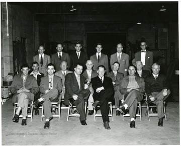 This picture was taken at the Evans Coal and Supply Co. on September 23, 1952 during on of the Disco Combustion School Classes. From Left To Right: Row 1: Andrew Basista, Basista Coal Co.; Thomas M. Cooksey Jr., Stevinson Coal Division of the Cooksey Coal Co.; Thomas M. Cooksey Sr., Cooksey Coal Co.; Carl Dunning, Brandon Coal Service Inc.; George Basista, Basista Coal Co.; Halter Shoak, Southern Coal Co.; Row 2: Robert Palmer, Palmer Fuel Co.; Gene J. Garde, Garde Coal Co.; Leo W. Dunning Sr., Secretary and Treasurer of Mahoning Coal Council and Mgr. of Coal Heating Service; Noah B. Hendson, Boardman Supply Co., Inc.; Carl L. Olson, J. R. Oldon Coal Co Inc.; Row 3: Bill Burns Pittsburgh Consolidated Coal Co.; Jack M. MacLachlan, Pittsburgh Consolidated Coal Co.; Tom Percie, Pittsburgh Consolidated Coal Co.; G.P. Stewart Jr., Pittsburgh Consolidated Coal Co.; J.S. Murray, Pittsburgh Consolidated Coal Co.; E.L. Yeller, Pittsburgh Consolidated Coal Co.