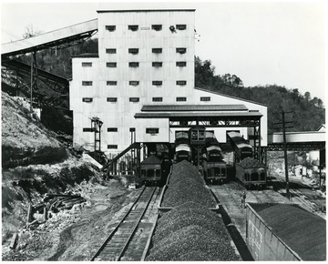 Coal cars being filled outside of preparation plant.