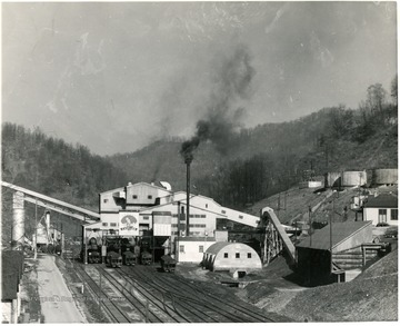 Plant with other coal buildings around it. 