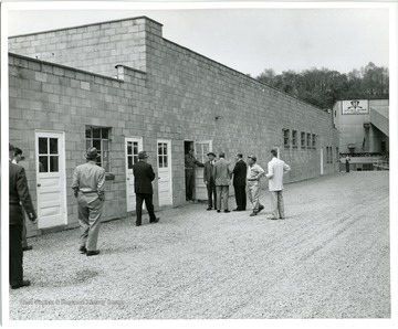 Employees are seen entering a building of the Consolidation Coal Co., Ohio Division.