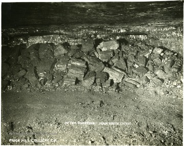 Pile of large chunks of coal inside a mine.