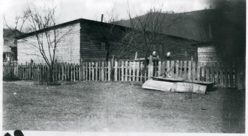 Picket fence and barracks at Chesapeake, W. Va.