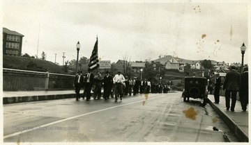Miners walk in a parade or a demonstration.