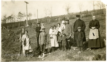 Men, women, and children standing on hillside in Tunnelton, W. Va.