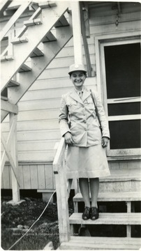 Goldie Zane Brooks standing on steps of barracks in Ft. Oglethorpe.  Director of Settlement House, 1942-1943.