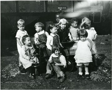 The picture presents a group of children in the first Nutrition Nursery School in Monongalia County, W. Va. directed by Dr. Stalnaker's class in Child Psychology.