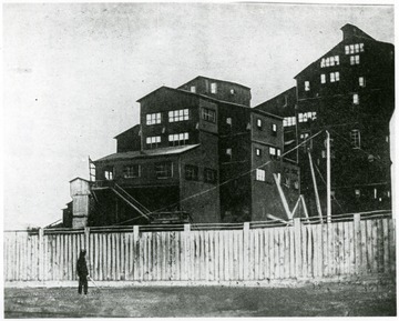 Coal mining facility with fence around it.