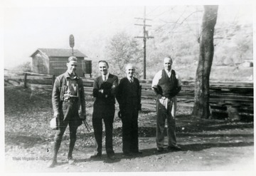 Group portrait from Left to Right: Charlie Smith, Mr. McGuire, Mr. Guinn, Lundy E. Meadows at Fire Creek.