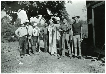 Group of men before garden work.