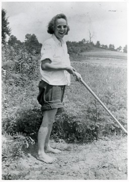Woman standing in garden.