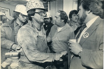 'United Mine Workers President Sam Church, right, greets miners at the Consol. Coal Co.'s Mathies Mine in Washington County at the 4p.m. shift change Thursday. Church is making seven state, five day tour of mines to promote the tentative contract that is to be voted on by the rank and file this coming Tuesday. Coal miners will go on strike as of 12:01 a.m. Friday in keeping of a long standing tradition of no contract, no work. (AP Laserphoto) (SEE AP WIRESTORY) (gjp51830stf-puskar)1981 Slug Words: PA MINERS.' 