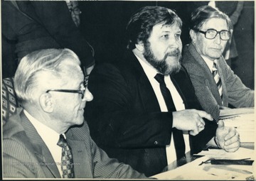 'Sam Church, center, president of the United Mine Workers; flanked by Wilbert Killion, left, vice president; and Harrison Combs, general counsel, meets with the 39 member bargaining counsel Tuesday in Washington. Church is seeking approval of the tentative contract agreed upon Monday morning with the soft coal industry. (AP Laserphoto) (see APAAA wire story) (tm31053stf/schwarz) 1981.'