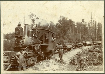 C.H. Akers, engineer (front) with other unidentifed railroad men.