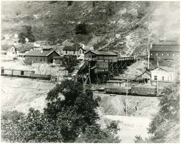 Mine tipple surrounded by other mine buildings.