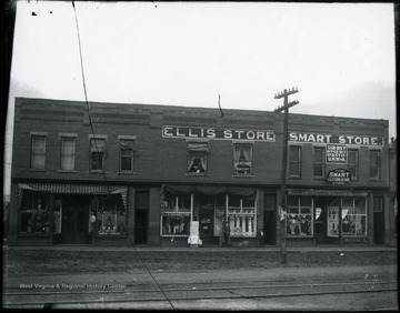 Large building with the Ellis Drygoods Store, the Smart Clothing and Shoe Store, Dr. D.G. Smallridge Dentist office, the Sub-District Office No. 1 of Dist. 17 U. M. W. A., and the Mecca, J.P Payne Proprieter.