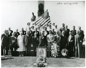 Ceremony at Miners Cemetary, Mt. Olive, Illinois.  First row, left to right 1)- 4)Unknown; 5)August Schoppman, Mayor of Mt. Olive; 6)William Green, AFL President; 7)Joe Ozanic, PMW President; 8)Bill Kack, previous president, PMW Dist. 1; 9)John McCann, board member, PMA Dist. 1; 10)Unknown 11)Bill Compton, Vice Pres. Dist. 1.;  2nd row 1)Unknown; 2)Mike Engleman, Mt. Olive Miner; 3)George Simbger, miner and Virden Massacre Veteran; 4)Unknown; 5)Unknown; 6)Hansen, Mt. Olive miner; 7)Matt Yurkovich, Mt. Olive miner; 8)Nick Piluga, Mt. Olive miner; 9 Bush Miller, Mt. Olive miner.