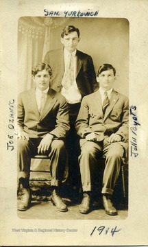 Group portrait of Joe Ozanic (right), Sam Yurkovich (middle, standing), and John Byots (left).