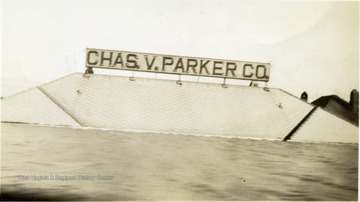 The Chas. V. Parker Co. filling station under water up to the roof.