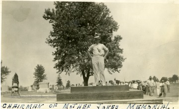 Chairman of the memorial is standing on top of foundation of the monument.
