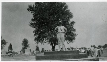Chairman of the memorial is standing on top of foundation of the monument. 