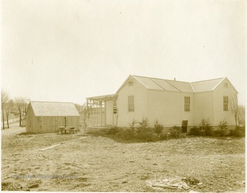 View of a recently completed house and shed.