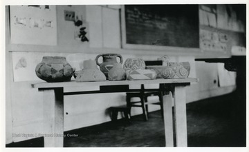 Painted pottery sitting on a table.