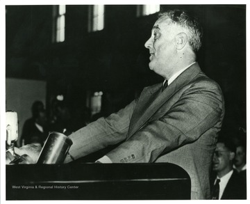 View of President Roosevelt speaking at Arthurdale High School in Preston County, West Virginia. 'A print form the Franklin D. Roosevelt Library Collection.  This print is furnished for your file and must not be reproduced without the owner's permission.'
