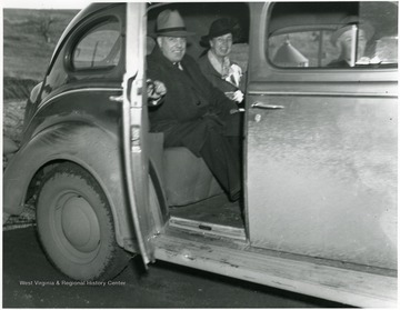 Eleanor Roosevelt in car with two men in Arthurdale, W. Va.