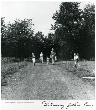 Children walking with father on country road. Title,"Welcoming Father Home". Information on the back of the photograph,'A print from the FDR Library collection This print is furnished for your file and must not be reproduced without the owner's permission. Album 359 FSA - Arthurdale W. Va.'