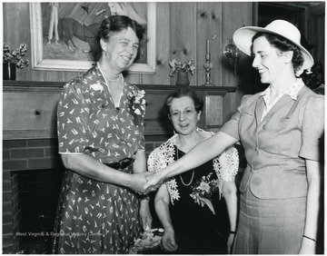 Eleanor Roosevelt shakes hands with ladies attending a reception at Arthurdale Inn in Arthurdale W. Va.