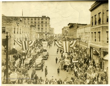 People fill the streets for the 100 Anniverary Celebration. 'Copyrighted 1955, All Rights Reserved By Harlow Warren, 320 North Kanawha St., Beckley, W. Va.'