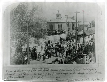 'Scene at the laying of the corner stone of the new Court House of Kanawha County, West Virginia. A copy of the proceedings is enclosed in the back of this portrait. John S. Cunningham, President of the Kanawha County Court.'