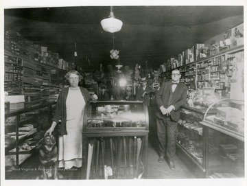 Customers and dog pose inside Alfred's Store in Poca, West Virginia.