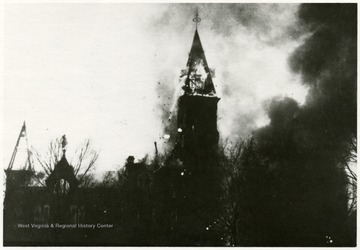 Tower of the Capitol Building engulfed in flames.