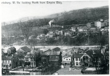 Houses line Pike Street in Clarksburg.  Glen Elk area is visible in background.