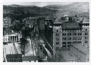 Postcard of various Clarksburg buildings, including Waldomore and the Waldo Hotel.  Bridge leads into Glen Elk section of Clarksburg.