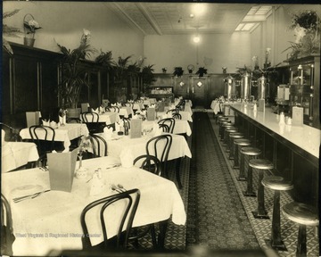 Interior of Andersons Restaurant, tables and bar visible.  'Inscription on Mount:  Andersons Restaurant Opened Apr. 2, 1918.  June 1, 1918.  From Elizabeth to Mother.'