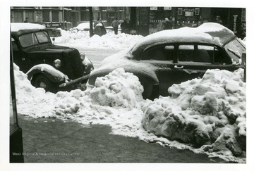 Cars are parked on Adams and Madison Streets in Fairmont, West Virginia during the big snow storm of 1950.