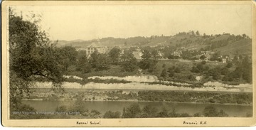 A close-up view of the new addition from Palatine Knob, in Fairmont, West Virginia.  Fairmont Normal School building is the tall building left of center.  Beeson's Hill bounds the city in the right background.  See photograph numbers 005811 and 005812 for a continuation of this view of Fairmont.