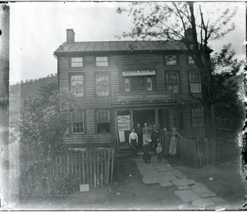 Group of people stand outside the River House at Grafton, W. Va.