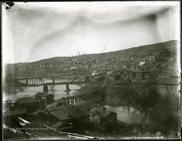 View of Grafton, W. Va. showing buildings on a hillside and bridges.