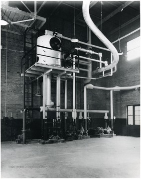 A large pump on the side of the wall.