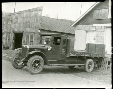 An empty truck is parked in front of Halbo Beverage Co. in Grafton, West Virginia.