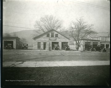 Several cars are parked in front of Dodge Brothers Motor Vehicles Garages in Grafton, West Virginia.