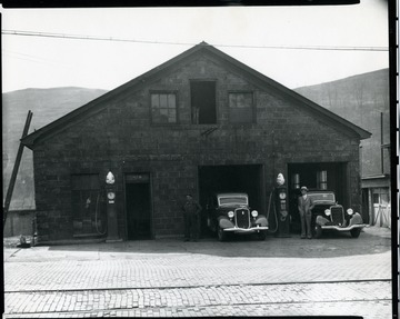 Cars exit the garages at a gas station in Grafton, W. Va.